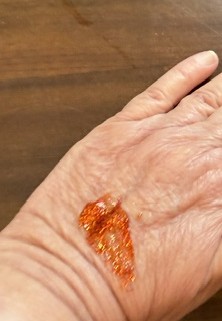 Glitter gel on the palm of a hand